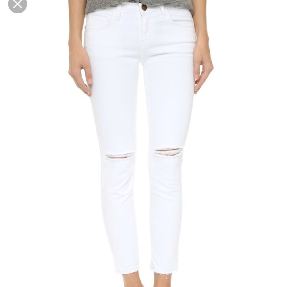 Distressed white jeans